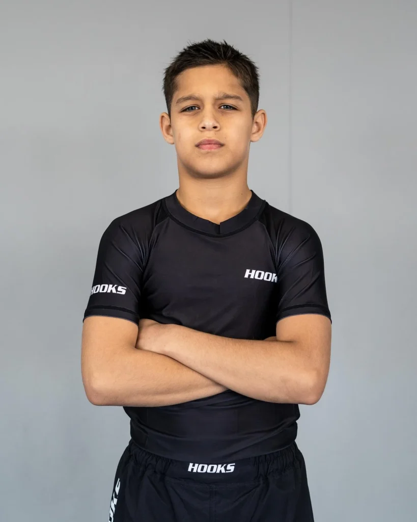Mikail Tamoz posing with arms crossed in training gear